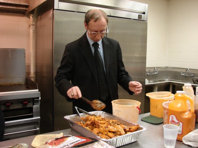 Mike dressed to the nines tossin' the wings