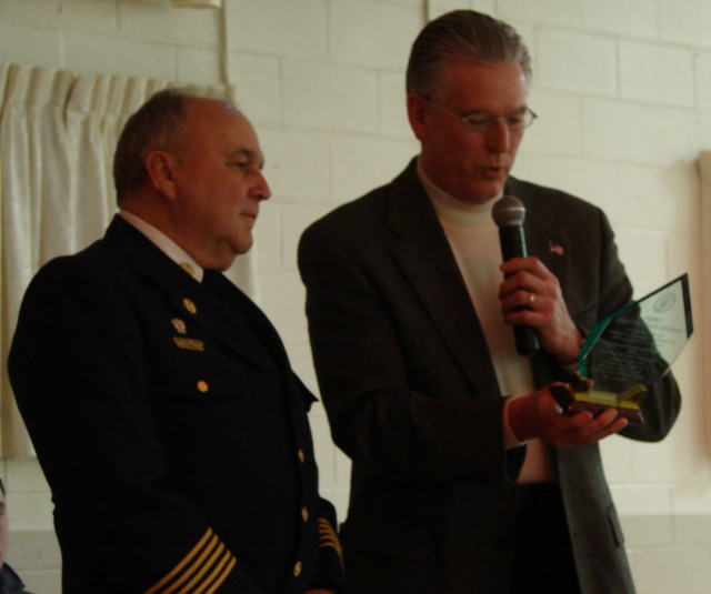 Chief Ray gives an award recognizing President Snyders 31 years as Chief of OBVFD as he retires from that position. 