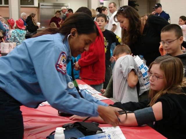 EMT Kess gives free blood pressure screenings at the 2008 Open House